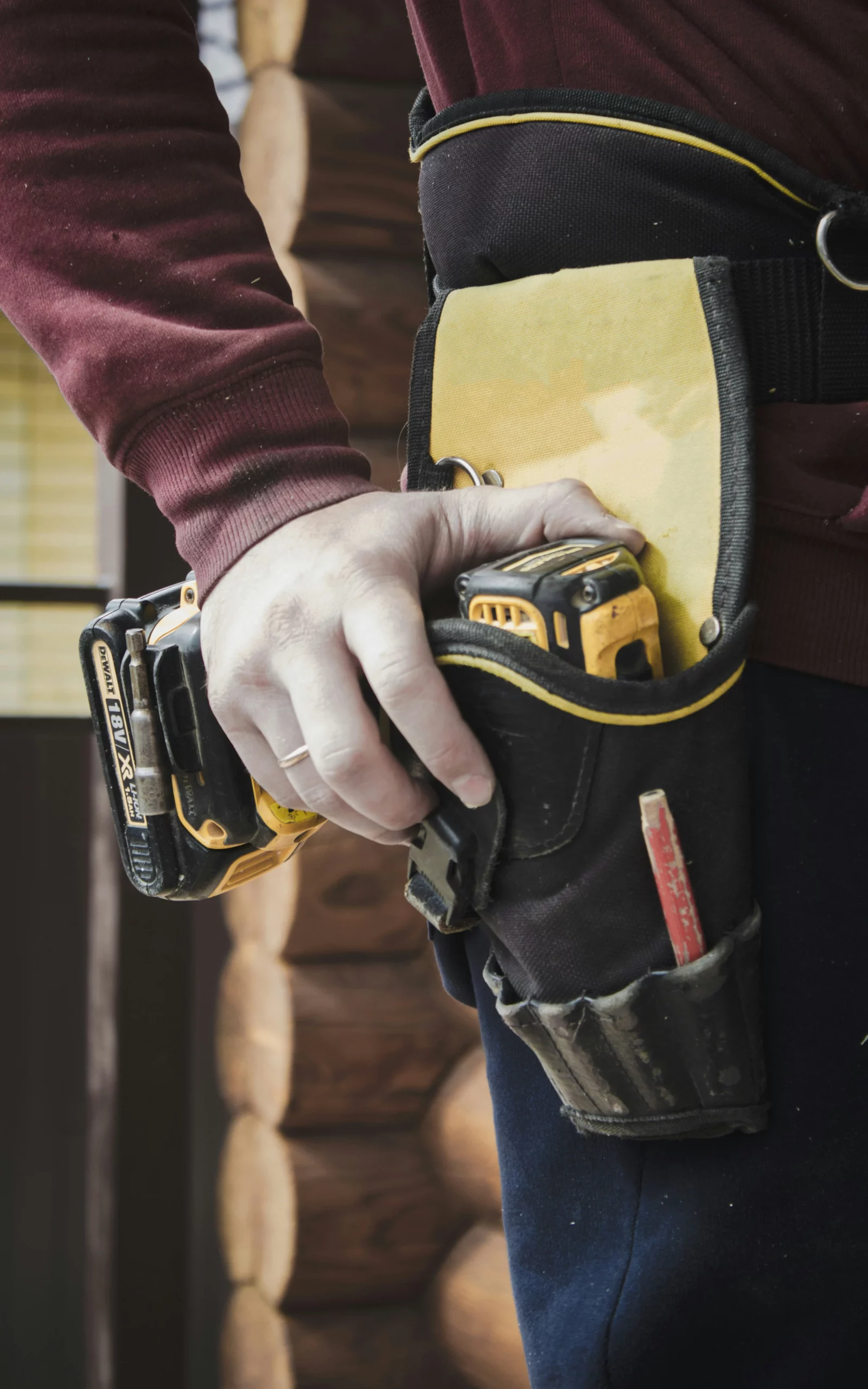 a person holding a tool belt